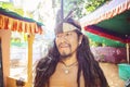 Portrait of young native american man with long black hair and Indian headdress Royalty Free Stock Photo