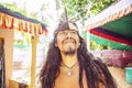 Portrait of young native american man with long black hair and Indian headdress Royalty Free Stock Photo