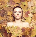 Portrait of young, natural and healthy woman over autumn background. Healthcare, spa, makeup and face lifting concept. Royalty Free Stock Photo