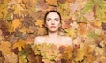 Portrait of young, natural and healthy woman over autumn background. Healthcare, spa, makeup and face lifting concept. Royalty Free Stock Photo