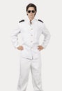 Portrait of young navy officer standing against gray background Royalty Free Stock Photo