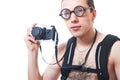 Portrait of a young nerd with old fashioned camera Royalty Free Stock Photo