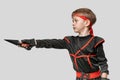 Boy training with kunai Royalty Free Stock Photo