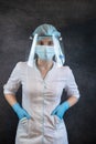 Portrait of young nurses wear individual protection white uniform, gloves glasses and hats