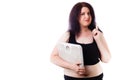 Portrait of young overweight attractive woman with pointing gest