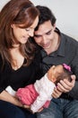 Portrait of young parents at home with their one month baby girl. Parenthood concept. Family love concept Royalty Free Stock Photo