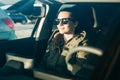 Portrait of a young passenger girl inside the car.