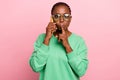 Portrait of young person speak telephone finger cover lips do not tell isolated on pink color background Royalty Free Stock Photo