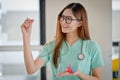 Portrait of a young pharmacist showing pills.