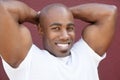 Portrait of a young physically fit African American man with hands behind head Royalty Free Stock Photo