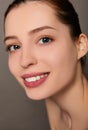 Portrait of a young pretty brunette with blue eyes close-up Royalty Free Stock Photo