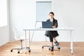 Portrait of young pretty business woman with laptop Royalty Free Stock Photo