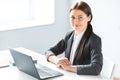 Portrait of young pretty business woman with laptop Royalty Free Stock Photo