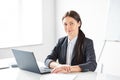 Portrait of young pretty business woman with laptop Royalty Free Stock Photo