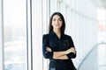 Portrait of young pretty business woman in the office.