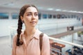 Portrait of young pretty caucasian woman contemplating at the artwork. Exhibition in the art gallery. Excursion and Royalty Free Stock Photo