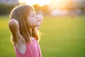 Portrait of young pretty child girl relaxing outdoors on warm summer day Royalty Free Stock Photo