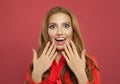 Portrait of young pretty excited surprised woman laughing on colorful bright pink background. Beautiful model girl Royalty Free Stock Photo