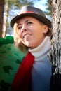 Portrait of young pretty funny smiling girl in male hat in sunny autumn day. Young happy woman having fun outdoor Royalty Free Stock Photo