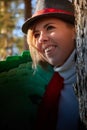 Portrait of young pretty funny smiling girl in male hat in sunny autumn day. Young happy woman having fun outdoor Royalty Free Stock Photo