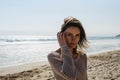 Portrait young pretty girl looking on summer beach, hipster in sand coastline on background seascape horizon blue sun ocean Royalty Free Stock Photo