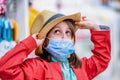 Portrait of a young pretty girl shopping hat, a girl posing and trying on a hat Royalty Free Stock Photo