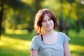 Portrait of young pretty girl in sunny summer park Royalty Free Stock Photo