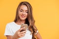 Portrait of a young pretty girl using mobile phone Royalty Free Stock Photo