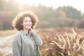 Portrait of young pretty mixed race teen girl outdoor in sunlight. Royalty Free Stock Photo