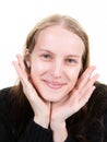 Portrait of young pretty positive girl smiling looking at camera two palm hands fingers on chin over white background Royalty Free Stock Photo