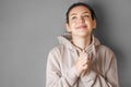 Portrait of a young pretty girl in a hoodie