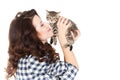 Portrait of a Young pretty woman holding her lovely little cat isolated on a white background Royalty Free Stock Photo