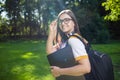 Young Pretty Woman with Laptop and Daypack Royalty Free Stock Photo