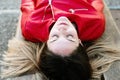 Portrait of young pretty woman, lying on her back resting placidly and relaxed Royalty Free Stock Photo