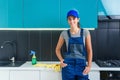 Portrait of young pretty woman in special uniform of professional cleaning service.