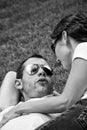 Portrait of young punk couple talking on the grass Royalty Free Stock Photo