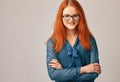 Portrait of young red-haired beauty in glasses Royalty Free Stock Photo