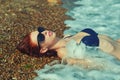 Portrait of a young red-haired woman on the sea Royalty Free Stock Photo