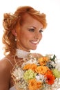 Portrait of a young redhead bride holding flowers Royalty Free Stock Photo