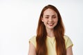 Portrait of young redhead girl face, long natural foxy hair and white smile, looking happy and carefree, standing Royalty Free Stock Photo