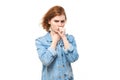 Portrait of young redhead woman coughing, suffering from sore throat isolated on white studio background. Respiratory disease Royalty Free Stock Photo