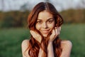 Portrait of a young redheaded woman looking into the camera and smiling, close-up portrait of a laughing woman in the Royalty Free Stock Photo