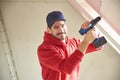 Young repairman working with hammer drill driver Royalty Free Stock Photo