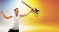 Portrait of the young rock star holding a guitar Royalty Free Stock Photo