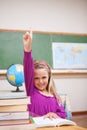 Portrait of young schoolgirl raising her hand Royalty Free Stock Photo