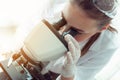 Portrait of young scientist research using microscope in a labor Royalty Free Stock Photo