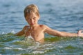 Cute Young boy in the lake