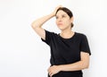 Portrait of young serious woman in black T-shirt looking up Royalty Free Stock Photo