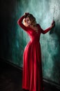 Portrait of young blonde woman in a red dress Royalty Free Stock Photo