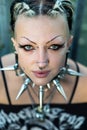 Portrait of young sexy, seductive gothic girl with piercings